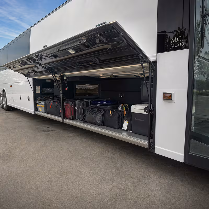 Party bus interior with wraparound leather seating and LED lighting in Dallas