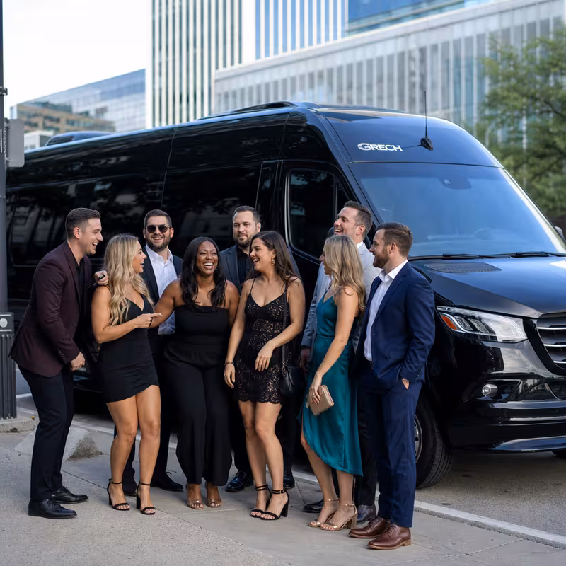Group boarding a white charter bus for Bachelor & Bachelorette Transportation transportation in Dallas