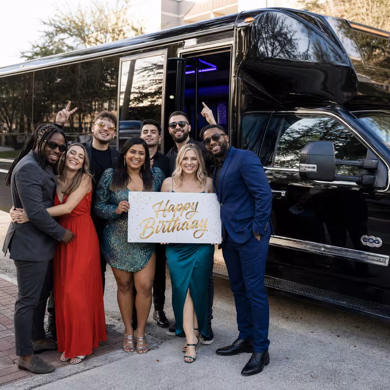 Party bus interior with wraparound leather seating and LED lighting in Dallas