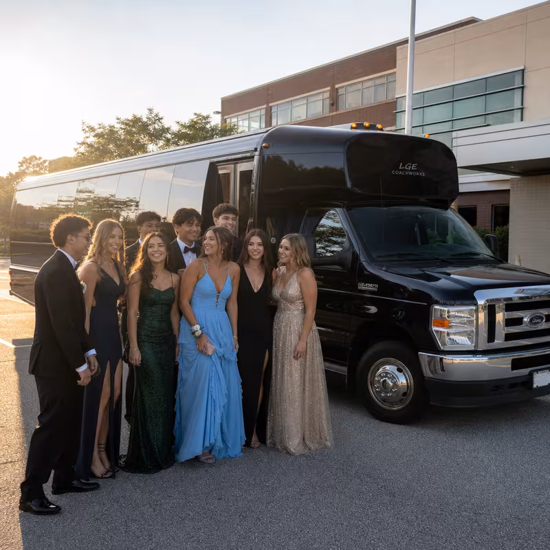 Group boarding a white charter bus for Prom & Homecoming Transportation transportation in Dallas