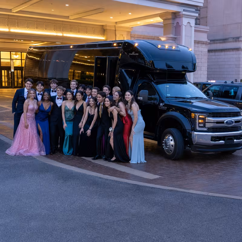 Party bus interior with wraparound leather seating and LED lighting in Dallas