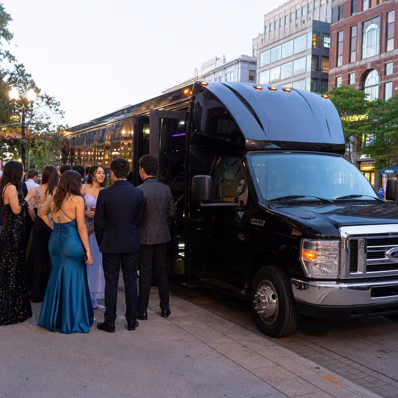 Passengers loading luggage while boarding an Dallas group shuttle