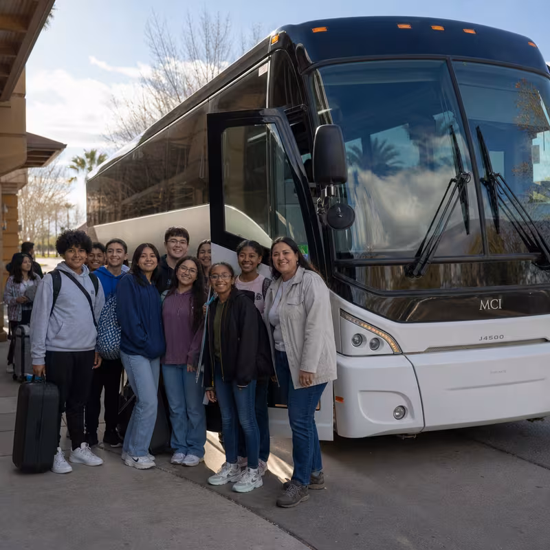 Passengers loading luggage while boarding an Dallas group shuttle