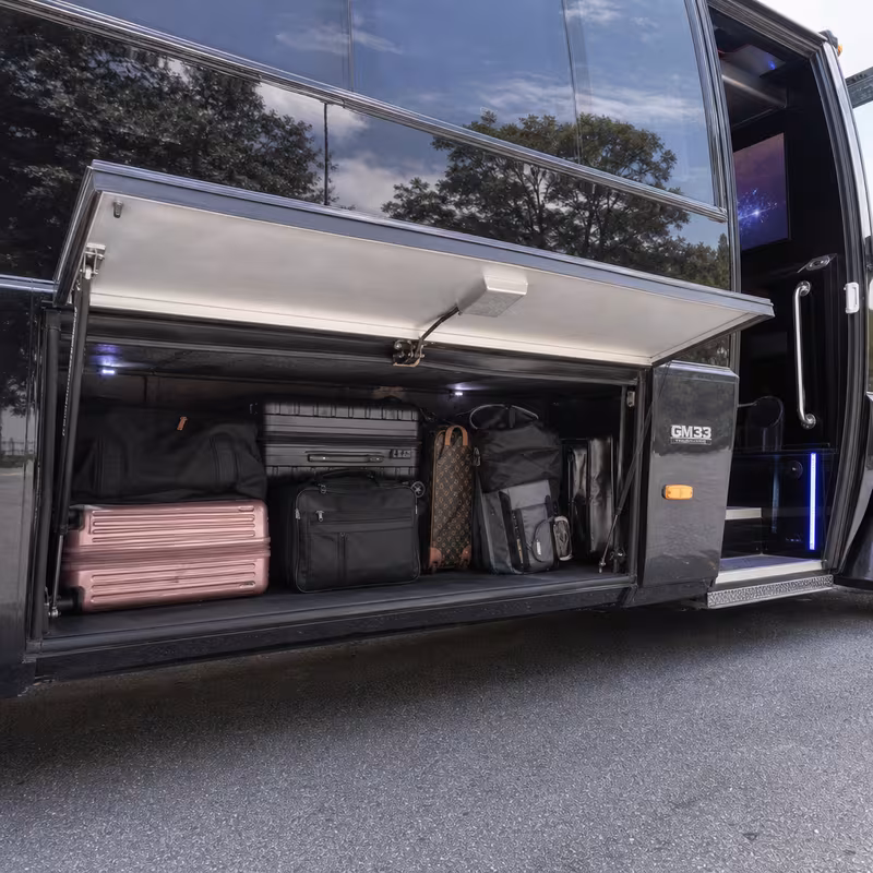 Party bus interior with wraparound leather seating and LED lighting in Dallas