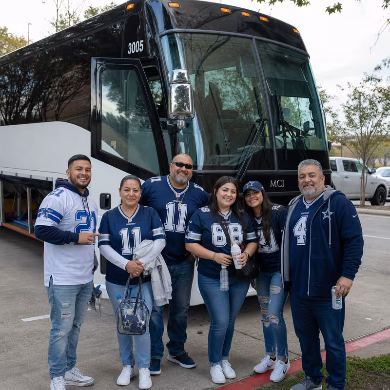 Passengers loading luggage while boarding an Dallas group shuttle
