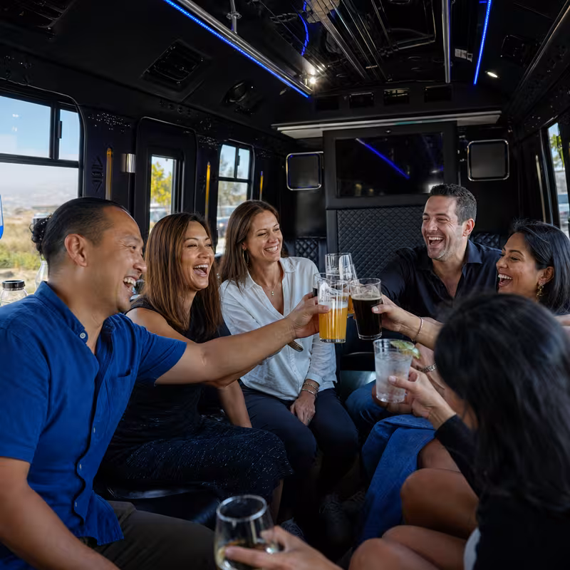 Group boarding a white charter bus for Winery & Brewery Tour Transportation transportation in Dallas